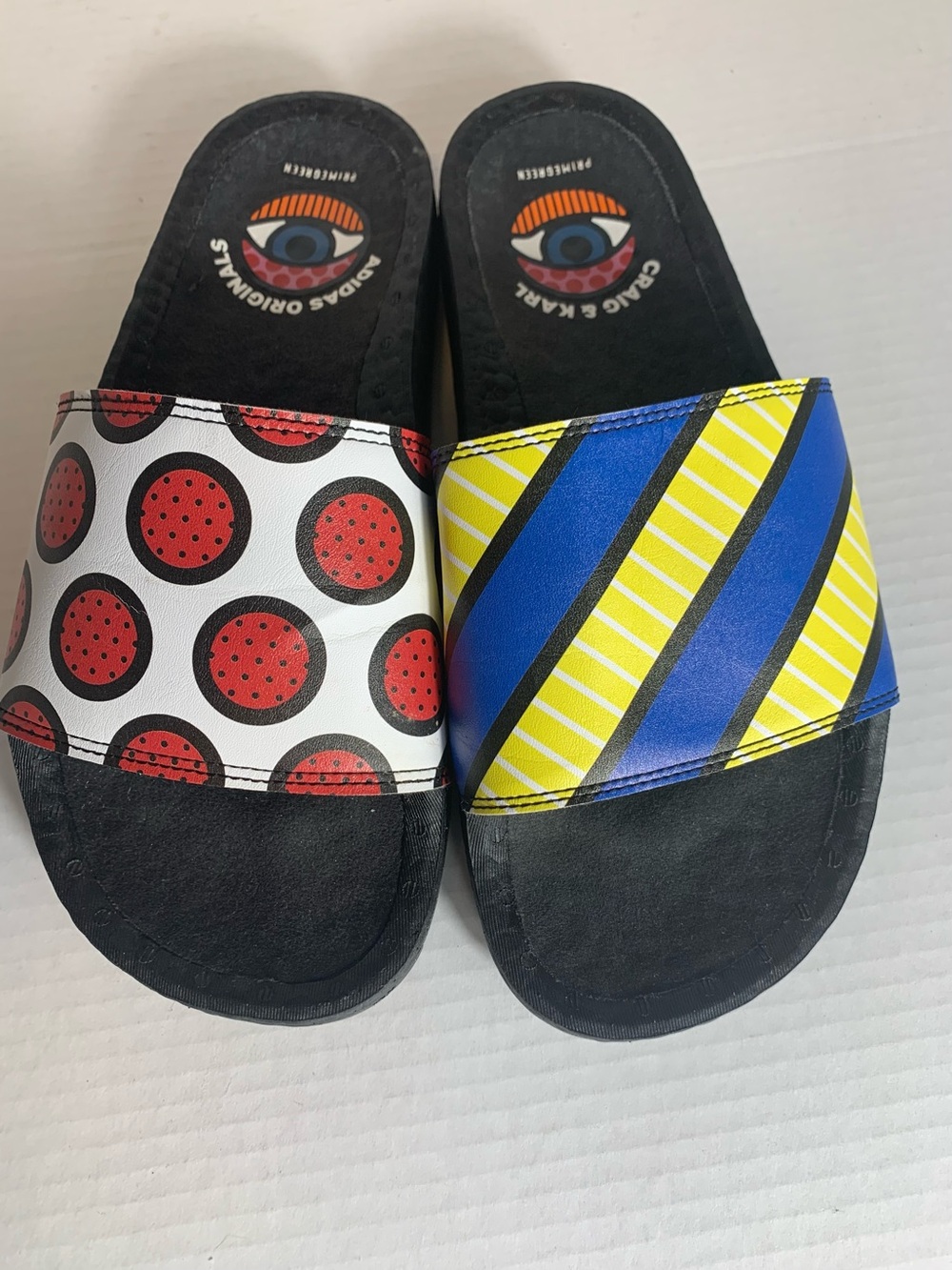 Adidas Adilette Boost x Craig & Karl slides with a pop art graphic design